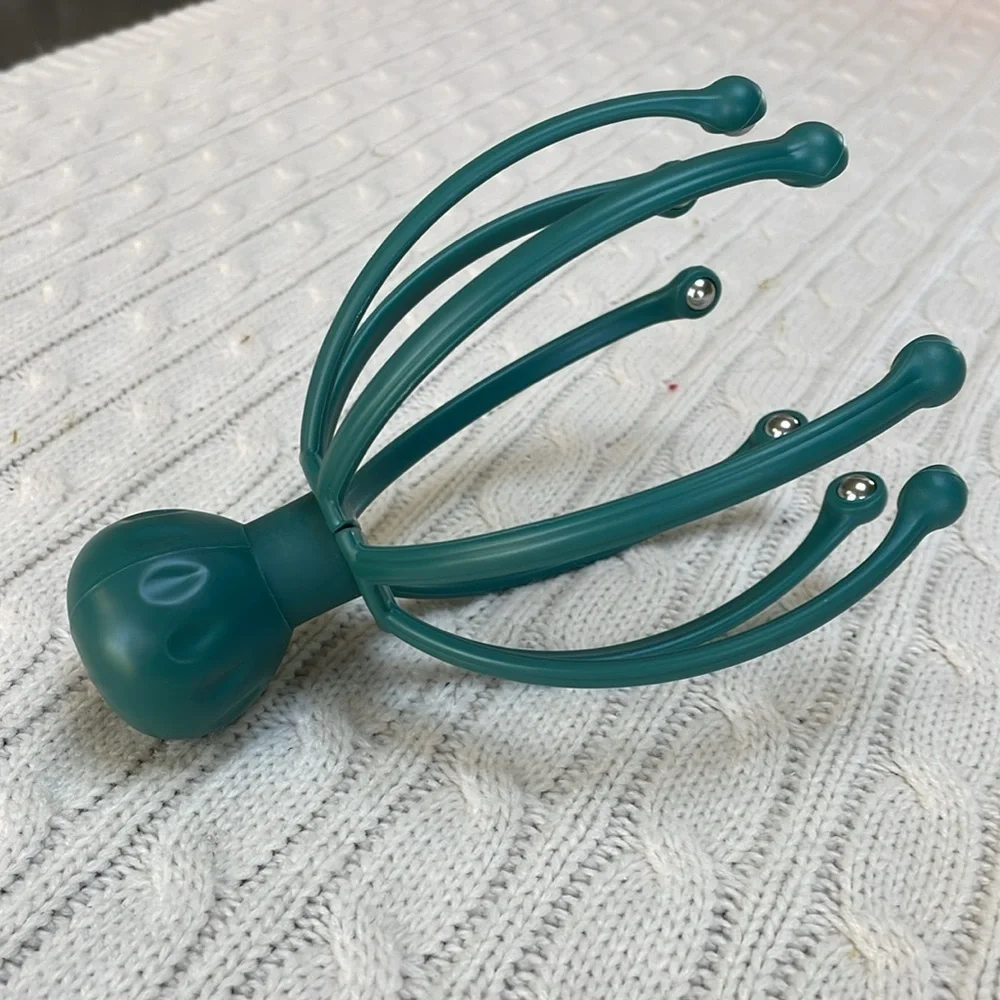 Scalp massager gently massages pressure points and sensitive nerves on head/neck